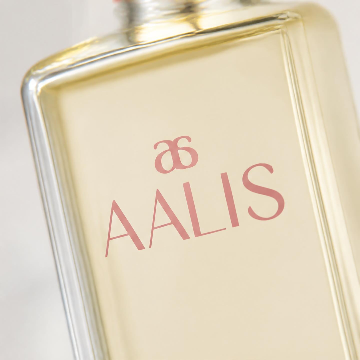 AALIS Dayana Micellar Cleansing Water bottle on a light marble surface.