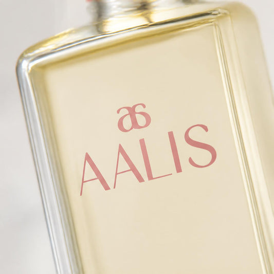 AALIS Dayana Micellar Cleansing Water bottle on a light marble surface.