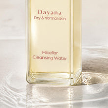 AALIS Dayana Micellar Cleansing Water bottle with cotton pad for makeup removal.