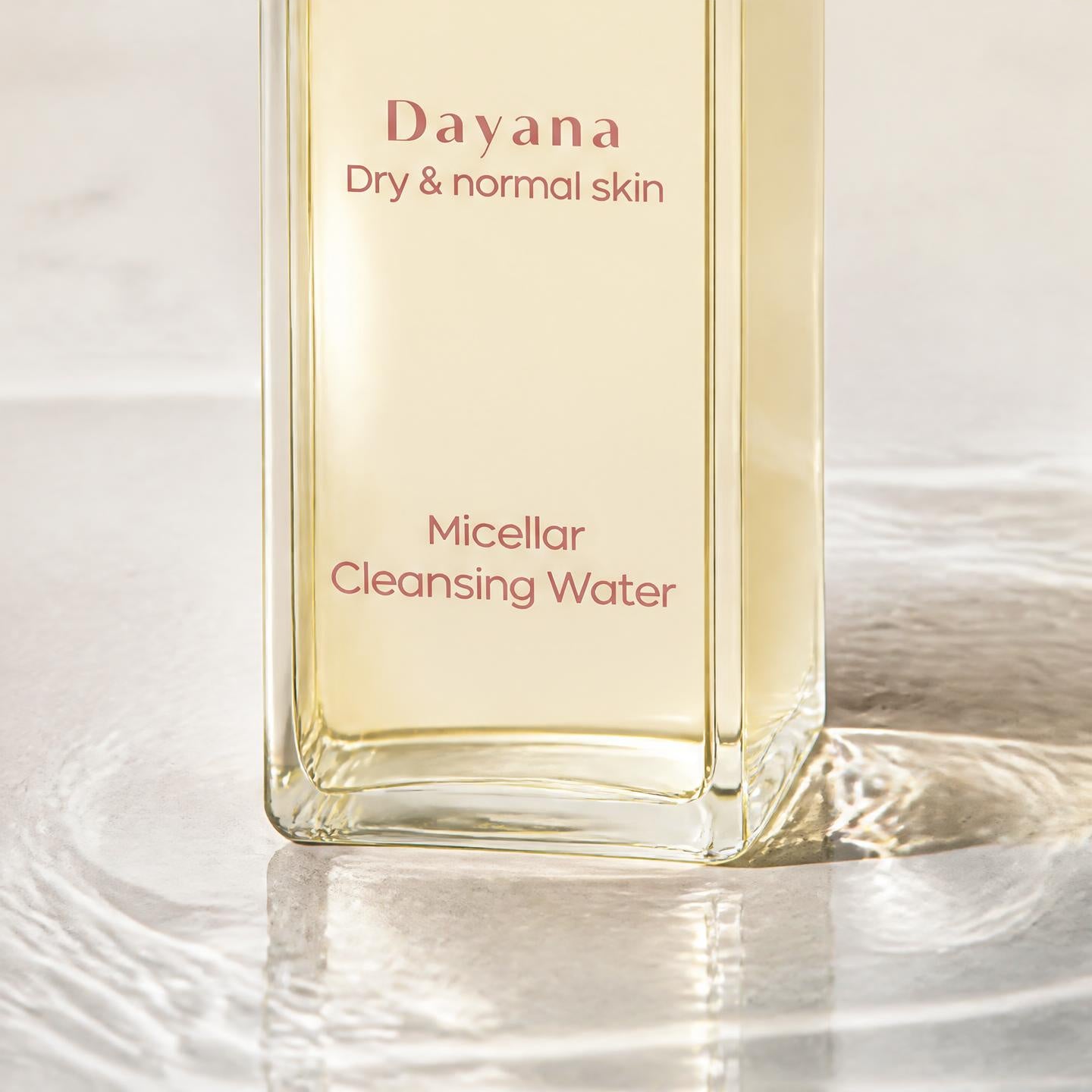 AALIS Dayana Micellar Cleansing Water bottle with cotton pad for makeup removal.